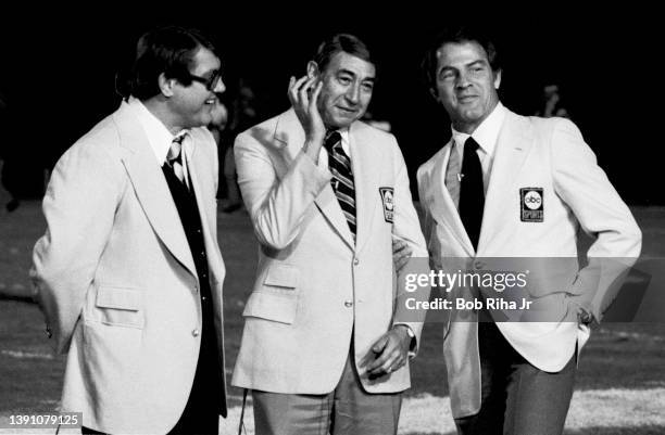Sports Broadcasters Alex Karras Howard Cosell and Frank Gifford before game action of Los Angeles Rams against Pittsburgh Steelers, December 20, 1975...