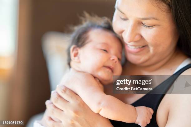native american mother and her baby - amerikansk indiankultur bildbanksfoton och bilder