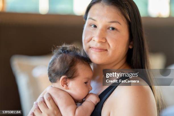 native american mother and her baby - native american family stock pictures, royalty-free photos & images