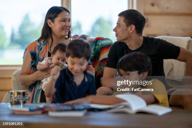 indigenous family time - parents baby sister stock pictures, royalty-free photos & images