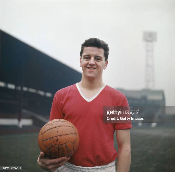 Manchester United player Tommy Taylor, one of the Busby Babes pictured in his United kit holding an orange match ball circa 1957 in Manchester,...