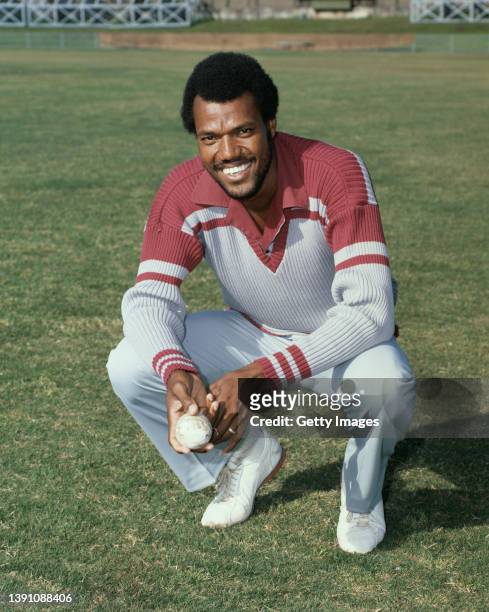 West Indies Fast Bowler Colin Croft pictured smiling and holding a white ball in coloured clothing possibly during the 1979/80 Benson & Hedges World...
