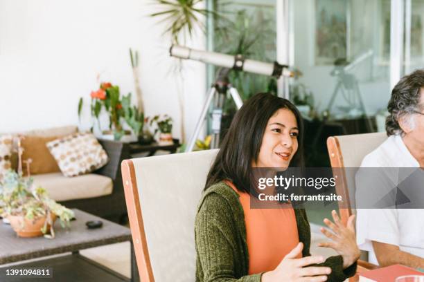 woman talking about science - book club meeting stock pictures, royalty-free photos & images