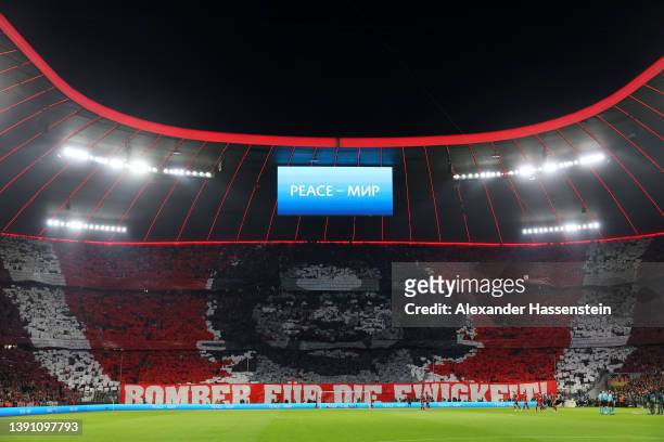 General view inside the stadium as fans display a tifo while the word 'peace' is displayed in English and Russian on a LED board prior to the UEFA...