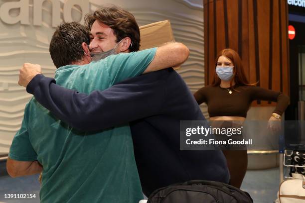 Tourists, friends and family are welcomed to Auckland International Airport on April 13, 2022 in Auckland, New Zealand. New Zealand borders reopened...