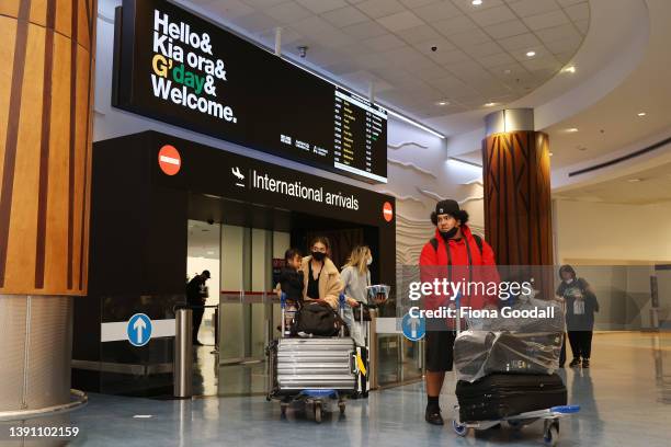 Tourists, friends and family are welcomed to Auckland International Airport on April 13, 2022 in Auckland, New Zealand. New Zealand borders reopened...