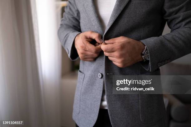 success matches perfectly with a stylish suit - jacket stock pictures, royalty-free photos & images