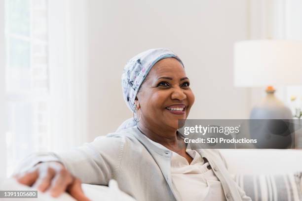 portrait senior female cancer patient looking away - cancer portrait stock pictures, royalty-free photos & images