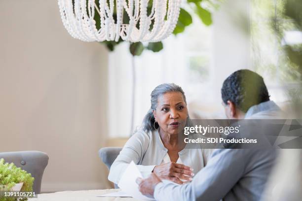 senior couple has serious discussion about home finances - males arguing stock pictures, royalty-free photos & images