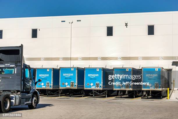 Miami, Florida, Amazon Fullfillment Center shipping docks with tractor trailor trucks.