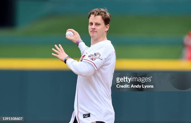 Joe Burrow of the Cincinnati Bengals throws out the ceremonial first pitch before the Cincinnati Reds game against the Cleveland Guardians at Great...