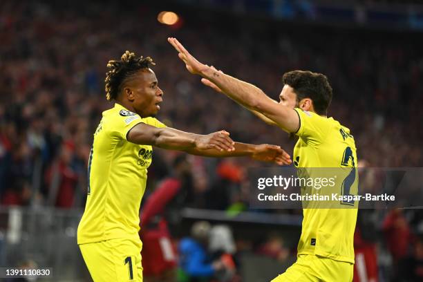 Samuel Chukwueze of Villarreal CF celebrates with teammate Alfonso Pedraza after scoring their team's first goal during the UEFA Champions League...