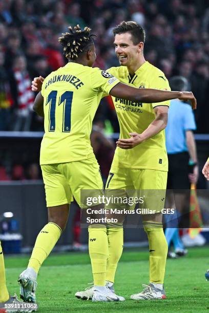 Samuel Chukwueze of Villareal celebrates after scoring his team's first goal with Gerard Moreno during the UEFA Champions League Quarter Final Leg...