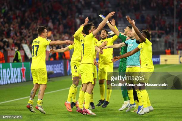 Players of Villarreal CF celebrate following their draw and advancement in the UEFA Champions League Quarter Final Leg Two match between Bayern...