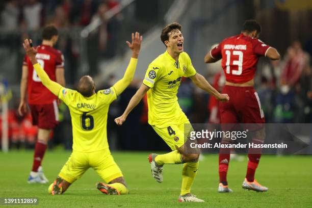 Pau Torres and Etienne Capoue of Villarreal CF celebrate following their draw and advancement in the UEFA Champions League Quarter Final Leg Two...