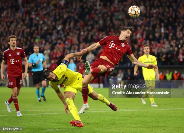 Robert Lewandowski of FC Bayern Muenchen clashes with Raul Albiol of Villarreal CF during the UEFA Champions League Quarter Final Leg Two match...