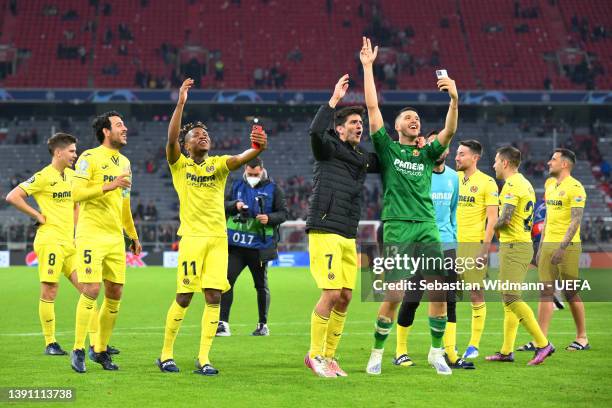 Players of Villarreal CF celebrate following their draw and advancement in the UEFA Champions League Quarter Final Leg Two match between Bayern...