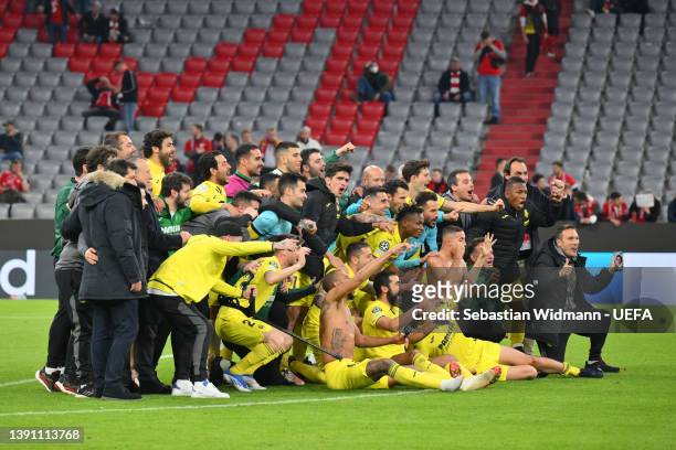 Players of Villarreal CF celebrate following their draw and advancement in the UEFA Champions League Quarter Final Leg Two match between Bayern...