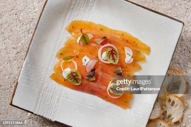 smoked trout with horseradish creme fraiche - square plate stock pictures, royalty-free photos & images