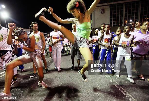 Brazilians perform capoeira on the first day of Carnival celebrations on February 16, 2012 in Salvador, Brazil. Capoeira is a Brazilian martial art...