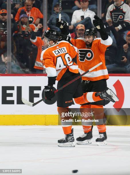 Noah Cates of the Philadelphia Flyers celebrates his first period goal against the Columbus Blue Jackets with Nate Thompson at the Wells Fargo Center...