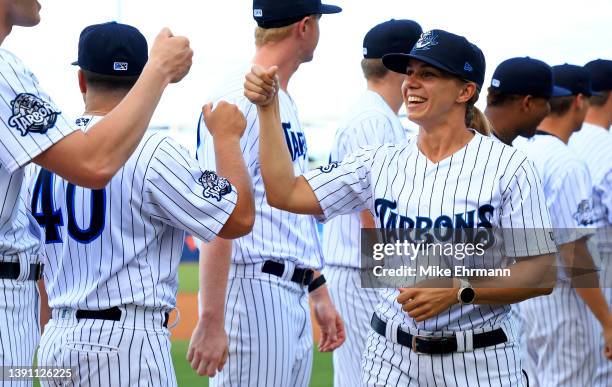 Tampa Tarpons Manager Rachel Balkovec is greeted by teammates during a game against the Dunedin Blue Jays at George M. Steinbrenner Field on April...