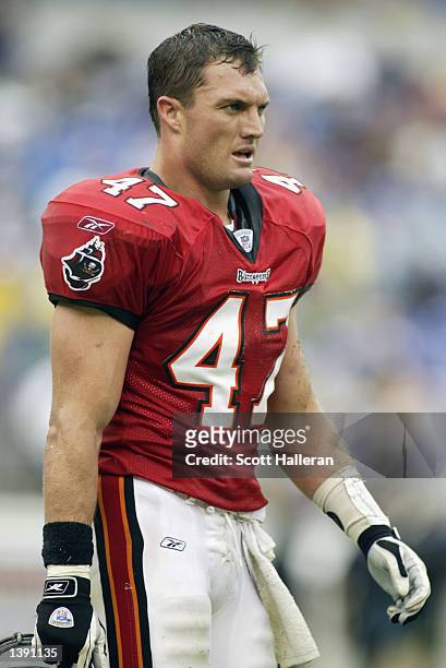 Safety John Lynch of the Tampa Bay Buccaneers walks on the field during the NFL game against the Baltimore Ravens on September 15, 2002 at Ravens...