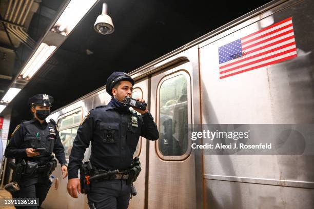 New York City police investigate an incident on an Uptown 4 subway after an emergency brake was pulled near Union Square on April 12, 2022 in New...