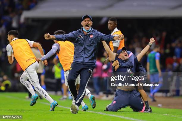 Coaches Hermes Desio Andrés Lillini of Pumas celebrate the victory during the 2nd leg semifinal match between Cruz Azul and Pumas UNAM as part of the...