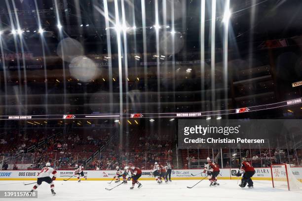 Dougie Hamilton of the New Jersey Devils passes the puck to Pavel Zacha during the third period of the NHL game against the Arizona Coyotes at Gila...