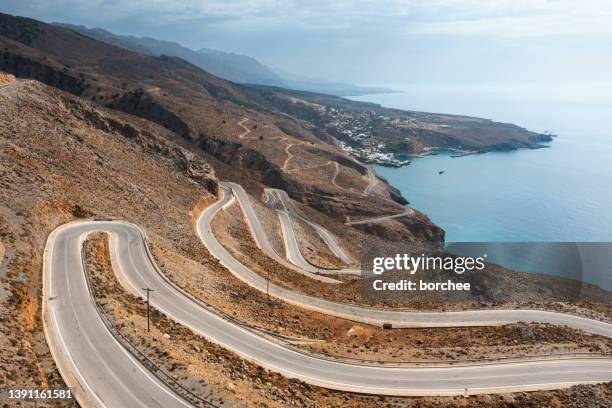 curvy mountain road in crete - crete mountain stock pictures, royalty-free photos & images