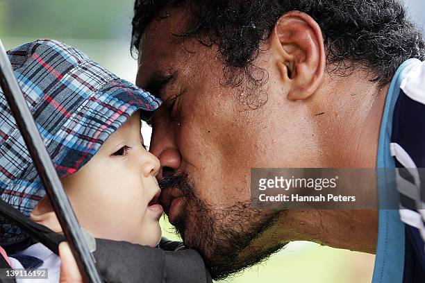 Jerome Kaino of the Blues kisses his baby after injuring his eye during the Super Rugby trial match between the Blues and the Highlanders at Unitec...