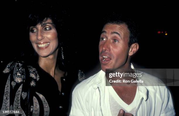 Singer/Actress Cher and producer David Geffen attend Eddie Murphy's Private Party on August 24, 1983 at the Hard Rock Cafe in Los Angeles, California.