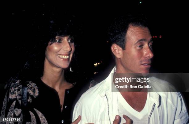 Singer/Actress Cher and producer David Geffen attend Eddie Murphy's Private Party on August 24, 1983 at the Hard Rock Cafe in Los Angeles, California.