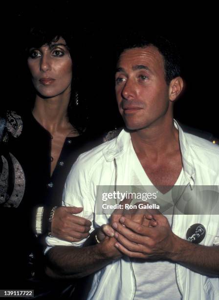 Singer/Actress Cher and producer David Geffen attend Eddie Murphy's Private Party on August 24, 1983 at the Hard Rock Cafe in Los Angeles, California.