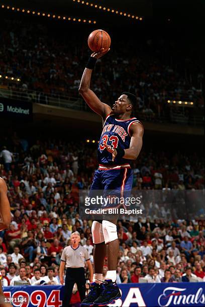 Patrick Ewing of the New York Knicks goes for a one handed jumper against the Houston Rockets during the 1994 NBA Finals in Houston, Texas. NOTE TO...
