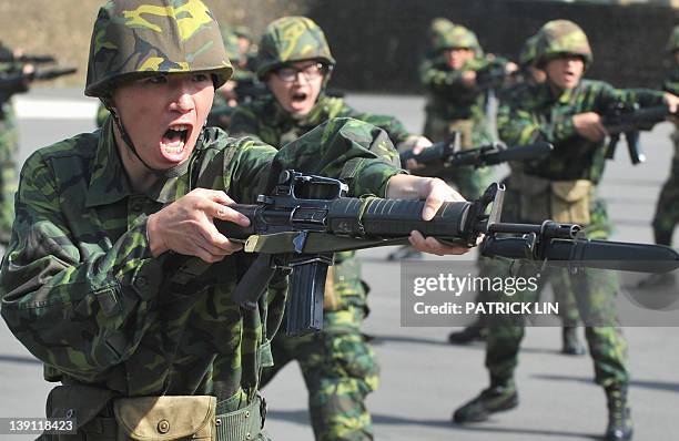 By Peter HARMSEN Recruits engage in bayonet drills at a military base in northern Taiwan on November 25, 2011. The armed forces of Taiwan are facing...