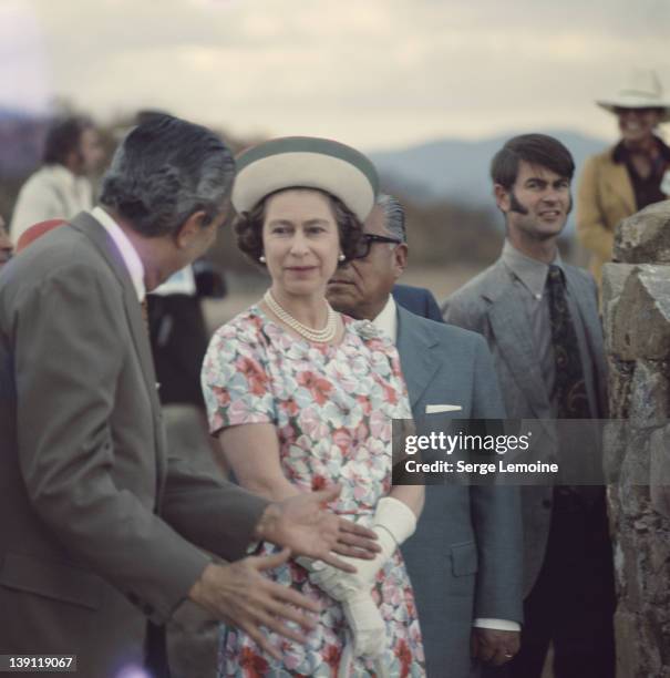 Queen Elizabeth II is taken to ancient site during her state visit to Mexico, 1975.