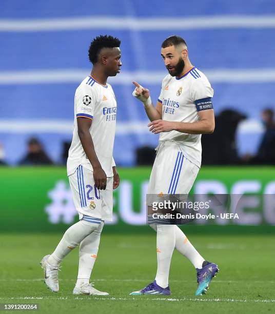 Karim Benzema of Real Madrid has a word with Vinicius Junior of Real Madrid during the UEFA Champions League Quarter Final Leg Two match between Real...