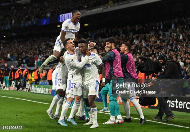 Karim Benzema of Real Madrid CF celebrates with his team mates after scoring his team's second goal during the UEFA Champions League Quarter Final...