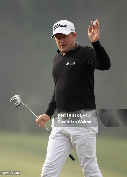 Jamie Donaldson of Wales acknowledges spectators during the second round of the Avantha Masters at DLF Golf and County Club on February 17, 2012 in...