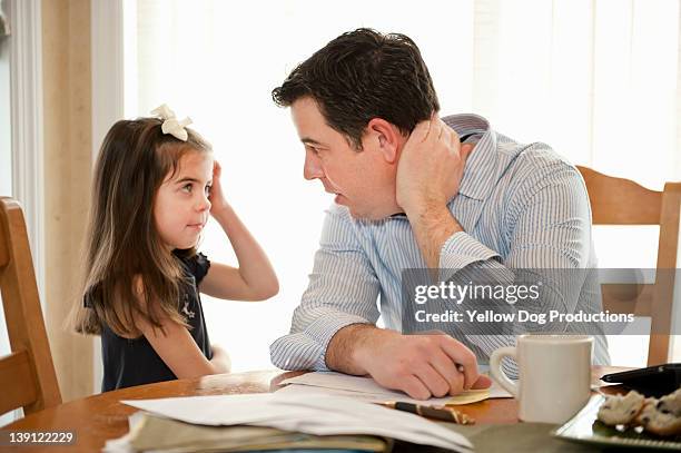 father talking to daughter while working - girl asking stock pictures, royalty-free photos & images