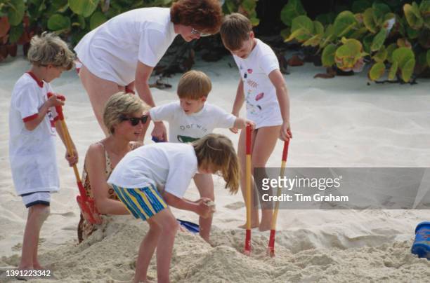 British Royal Diana, Princess of Wales , wearing a leopard print swimsuit holidaying with her sons Prince William and Prince Harry and sister, Sarah...