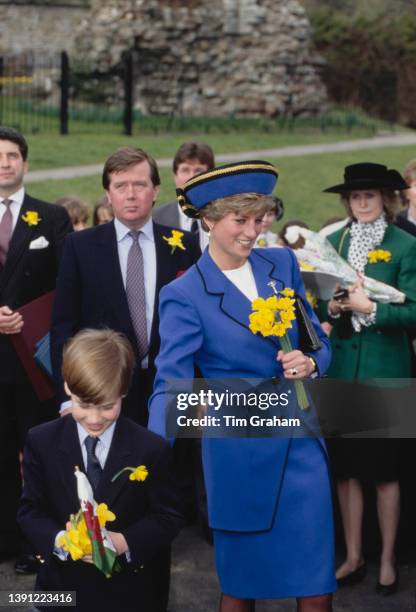 British Royals Prince William and his mother, Diana, Princess of Wales , wearing a blue suit, attend William's his first official engagement on St...