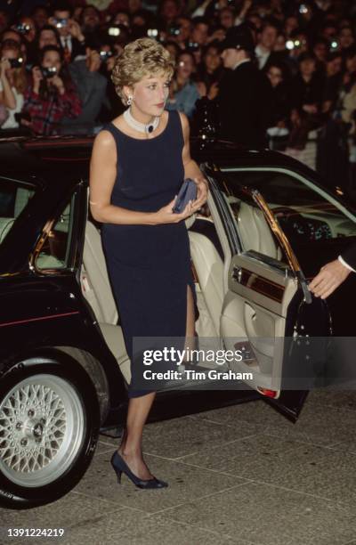 British Royal Princess Diana, Princess of Wales , wearing a midnight blue dress with a pearl choker, at the UK premiere of 'The Fugitive,' held at...