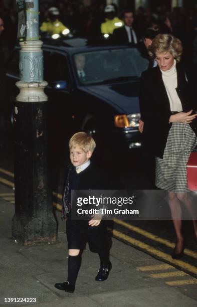 British Royals Prince Harry and his mother, Diana, Princess of Wales arrive for Ludgrove School's Christmas Carol Concert, held at the Palace Theatre...