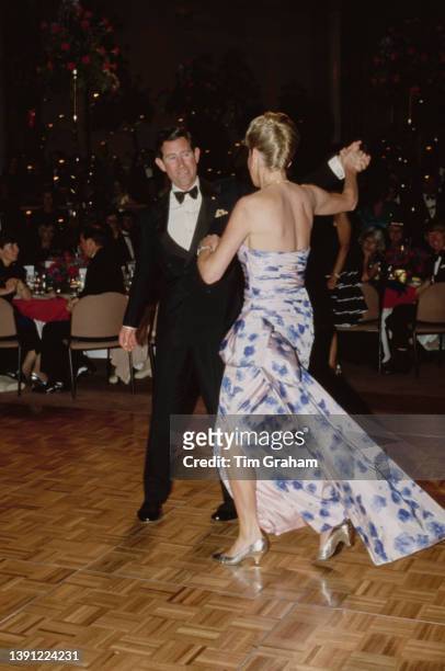 British Royals Charles, Prince of Wales and his wife, Diana, Princess of Wales , wearing a blue chintz taffeta Catherine Walker ballgown, dance...