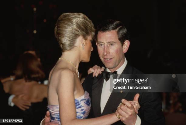 British Royals Diana, Princess of Wales , wearing a blue chintz taffeta Catherine Walker ballgown, and her husband Charles, Prince of Wales dance...