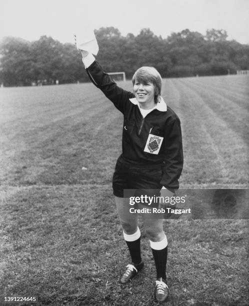 British lineswoman Liz Forsdick, Britain's first lineswoman, runs the line in her first match, Burgess Hill against Carshalton, in Burgess Hill, West...