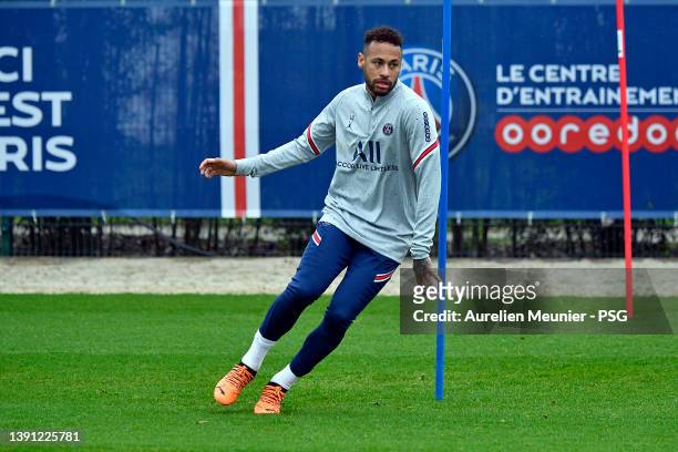 Neymar Jr warms up during a Paris Saint-Germain training session at Ooredoo Center on April 13, 2022 in Paris, France.
